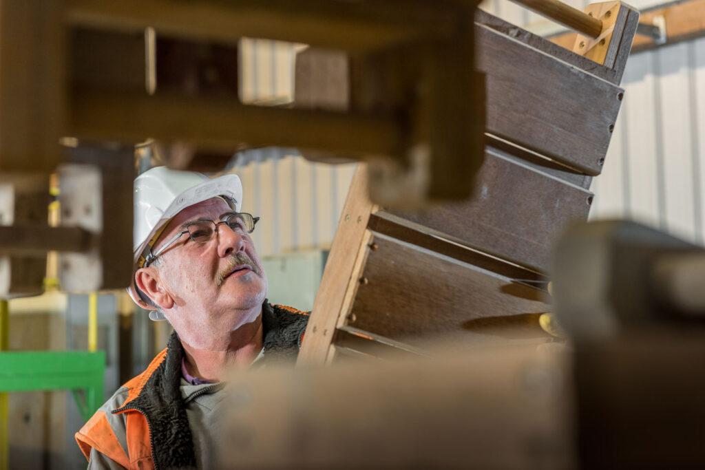 Worker inspecting brick moulds